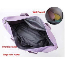 Load image into Gallery viewer, Inside view of light purple foldable travel bag showing large main pocket, inner slot pocket, and wet pocket.
