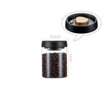 Load image into Gallery viewer, Glass airtight canister with black lid, vacuum-sealed for storing coffee beans, kitchen food storage jar.
