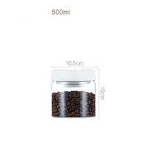 Load image into Gallery viewer, 500ml vacuum-sealed glass canister with coffee beans, airtight design for kitchen storage.
