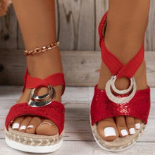 Load image into Gallery viewer, Women&#39;s red peep toe serpentine wedge sandals with circle design.
