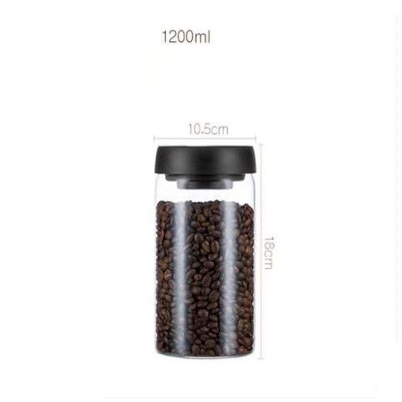 Glass airtight canister with black lid, filled with coffee beans, 1200ml capacity, 18cm height, 10.5cm diameter, ideal for kitchen storage.